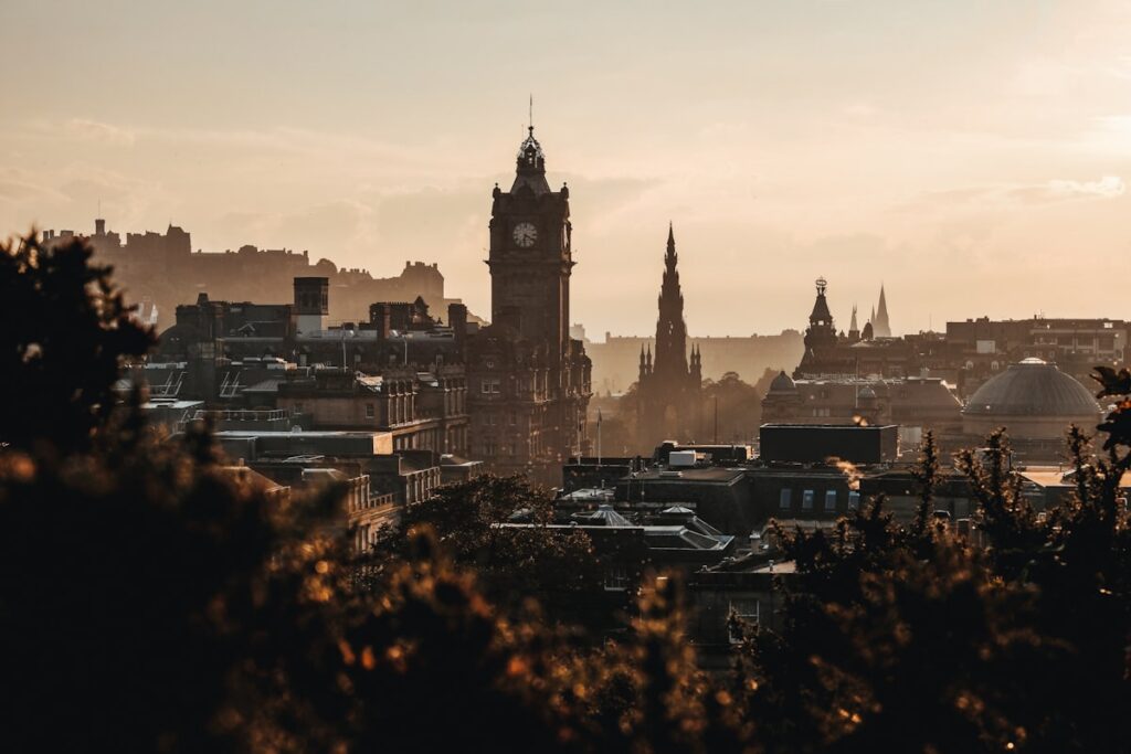 Edinburgh skyline at sunset with Edinburgh Castle and the Balmoral Hotel — home of the Edinburgh Fringe Festival